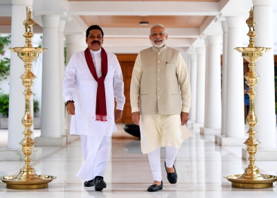 Sri Lankan Prime Minister Mahinda Rajapaksa walks with Indian Prime Minister Narendra Modi on September 12, 2018 in New Delhi, India. 